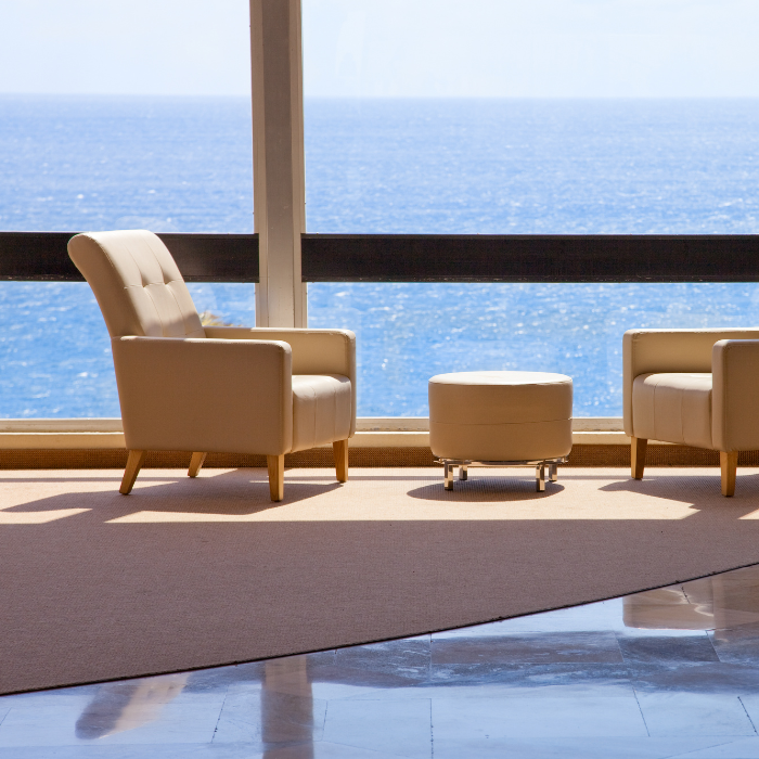 Seating-and-upholstery Tan lounge chair seating in hotel lobby